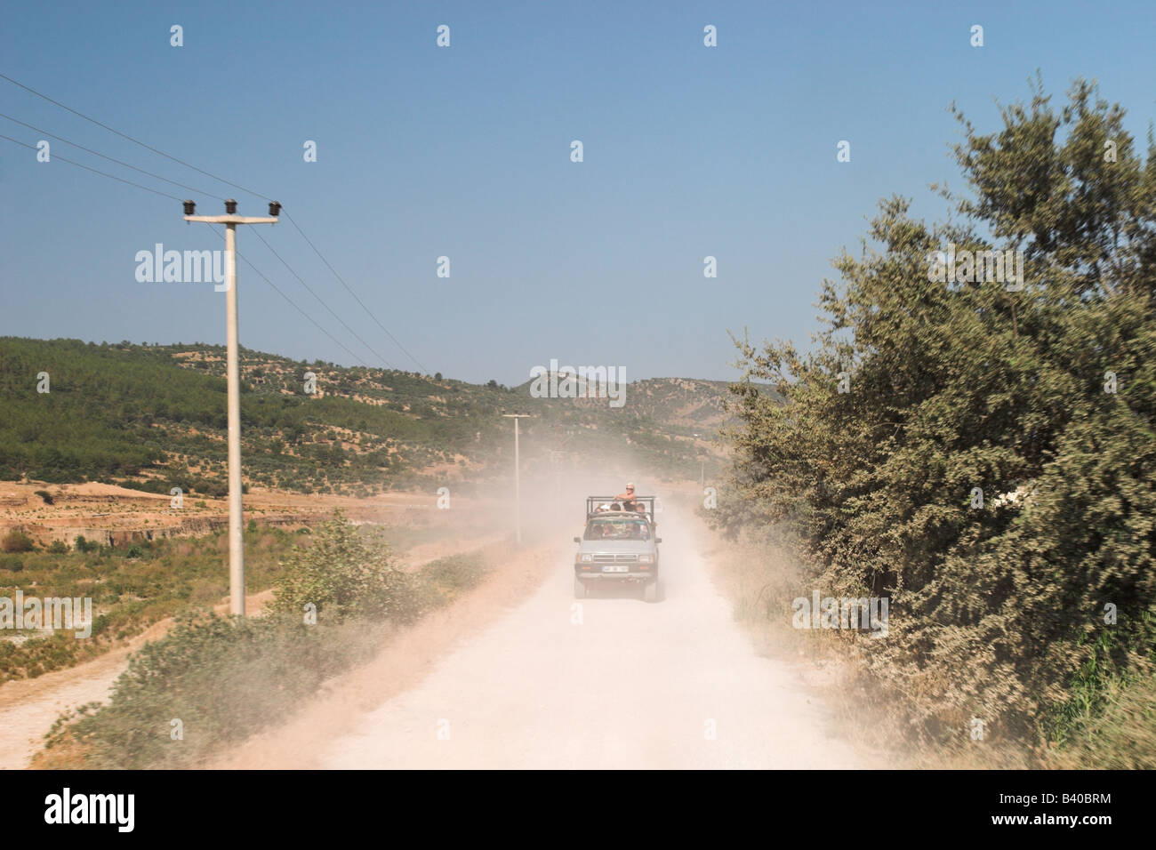 Jeep safari 4x4 travelling along a dusty road, Bodrum, Turkey Stock Photo