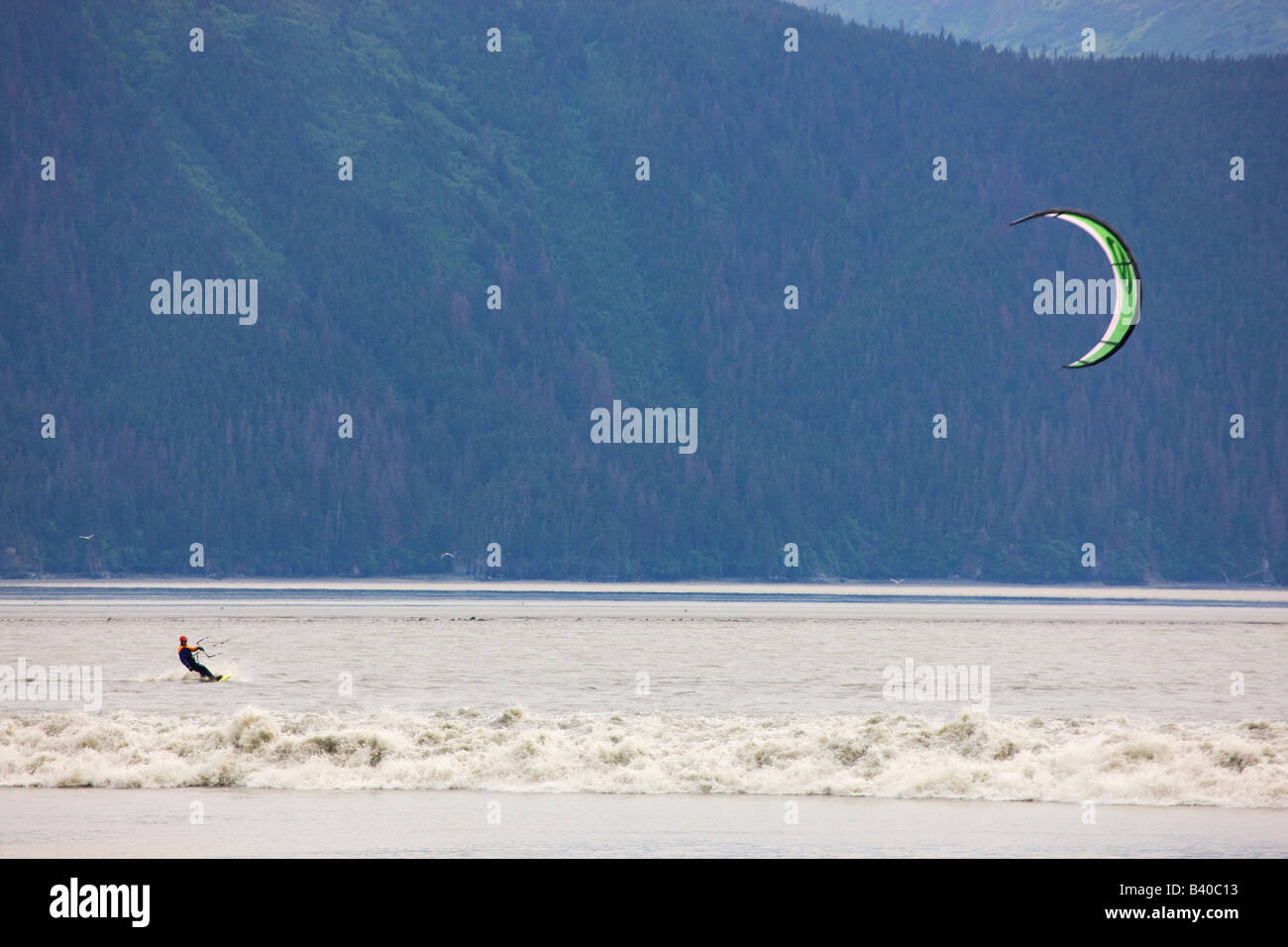 Troy kiteboarding the Bore Tide on Turnagain Arm near Anchorage Alaska Stock Photo