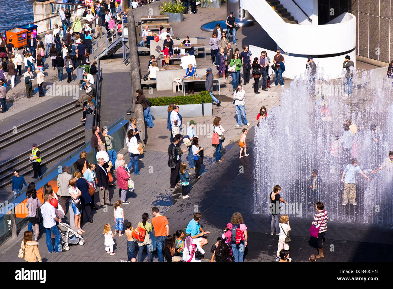 People enjoy warm summer day 'South bank Centre' London United Kingdom Stock Photo