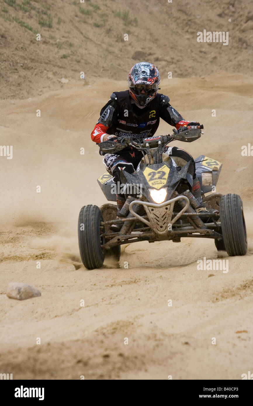Quad rider during off road race Stock Photo Alamy