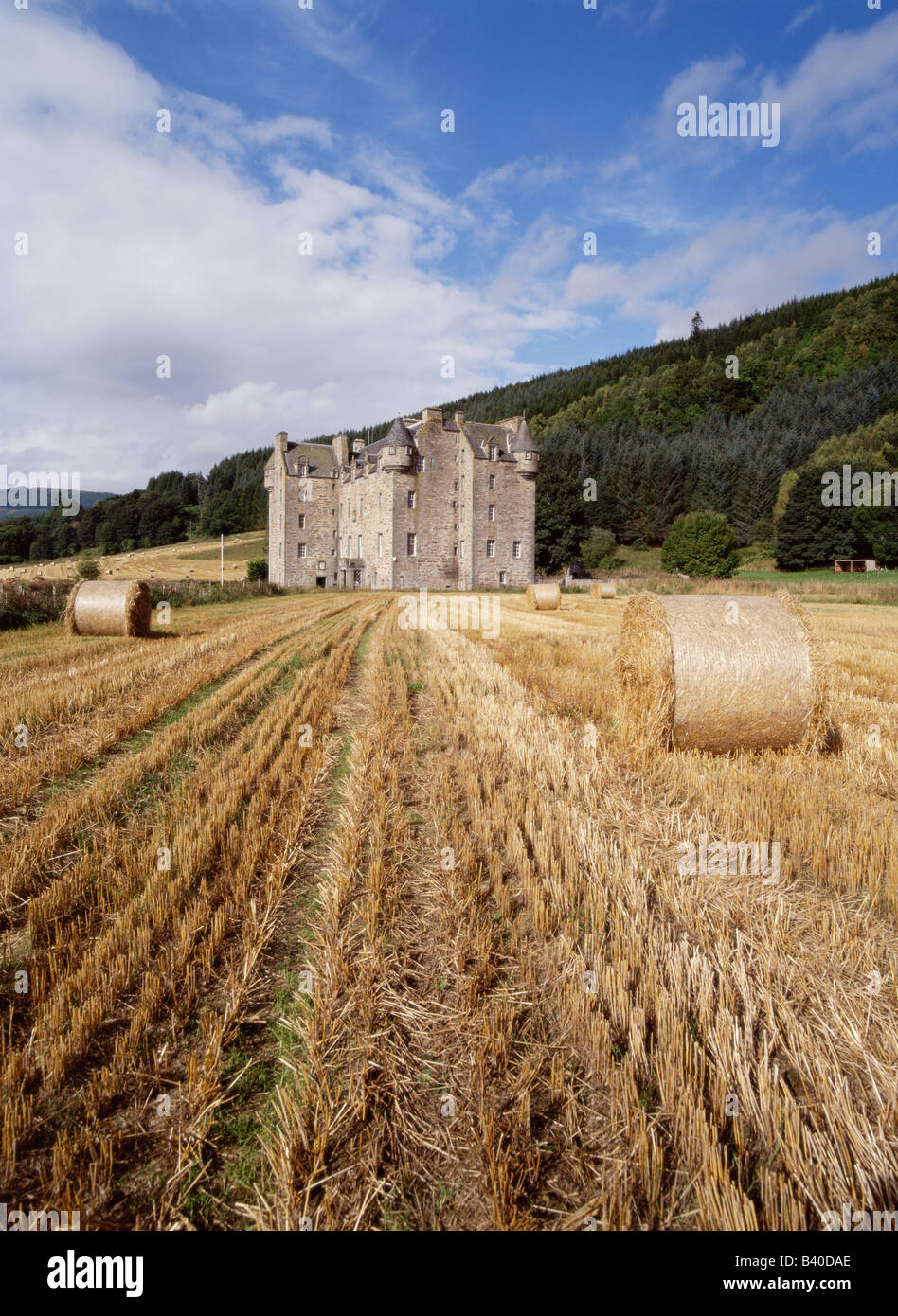 dh  MENZIES CASTLE PERTHSHIRE Highlander clan laird house castle home field and harvested bales scotland highlands lairds family highland fields Stock Photo