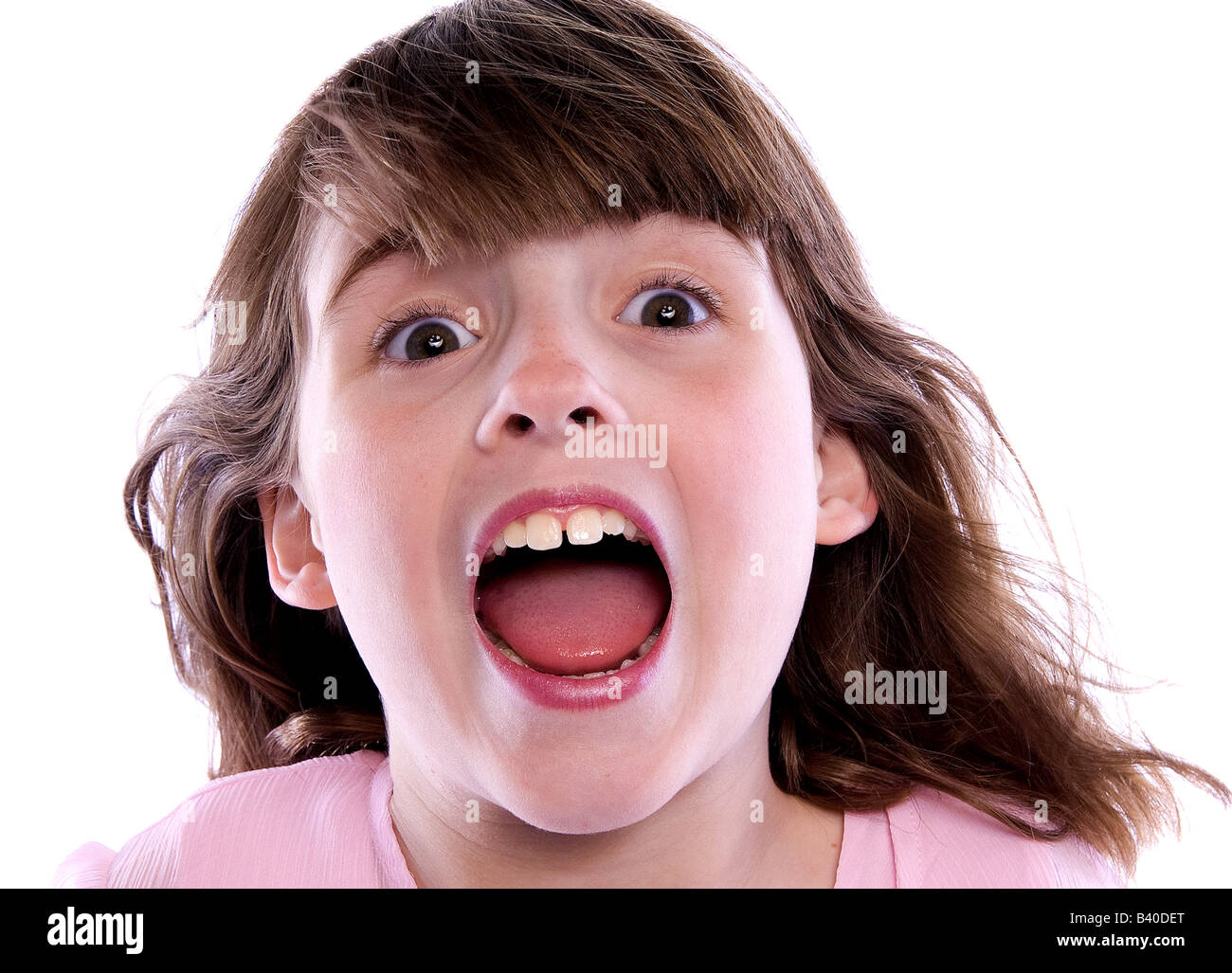 Joyful Young girl with mouth open isolated on white background Stock Photo