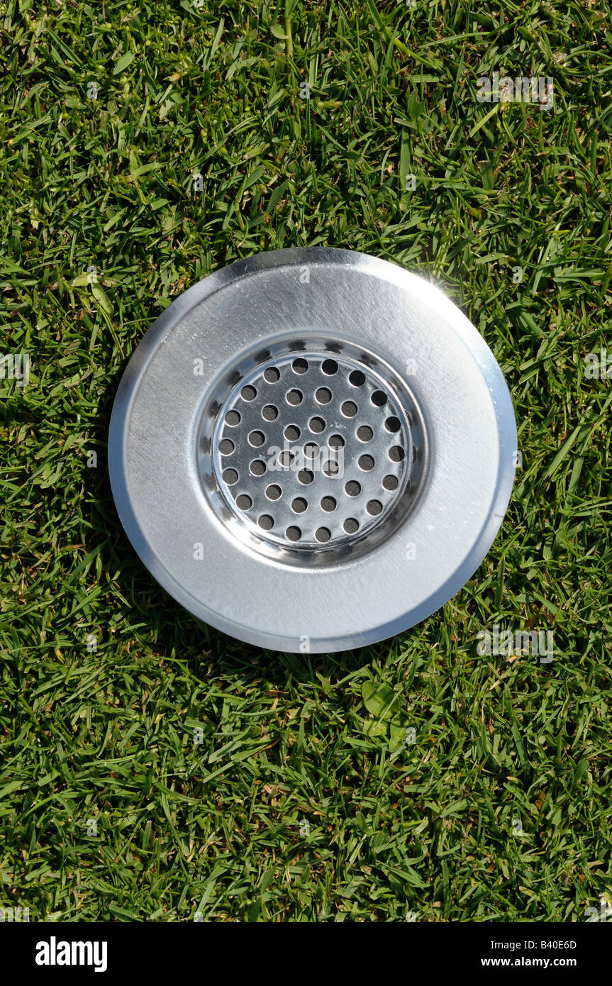 Plug drain in a lawn Stock Photo Alamy