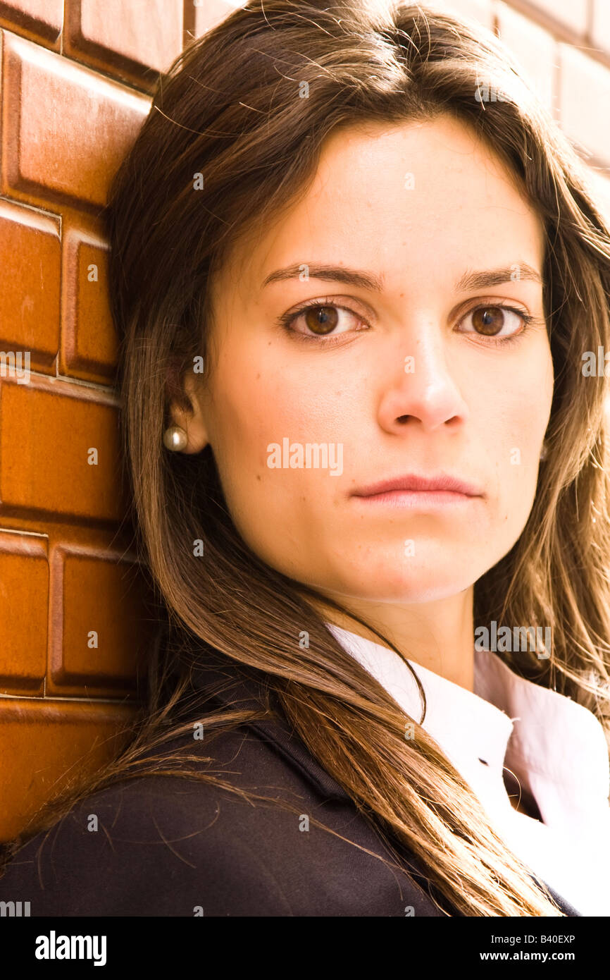 Long haired businesswoman staring at camera Stock Photo