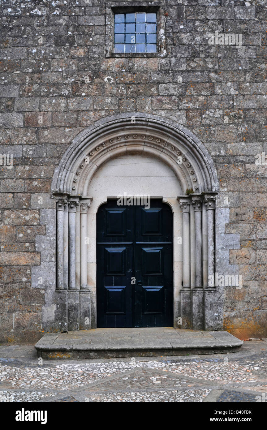 a church closed door with a window in the top Stock Photo