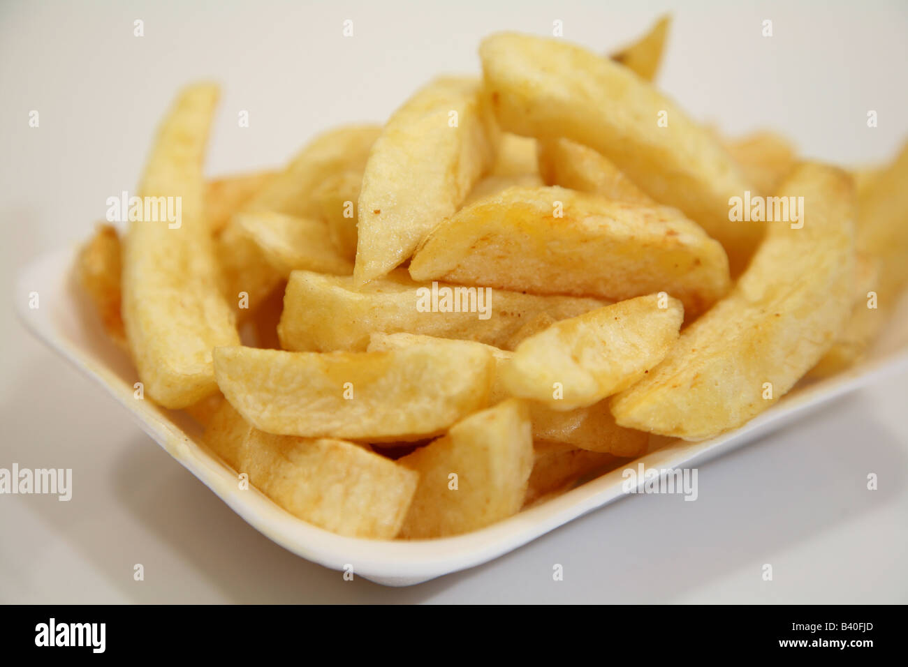 Tray of tradtional chip shop chips Stock Photo - Alamy