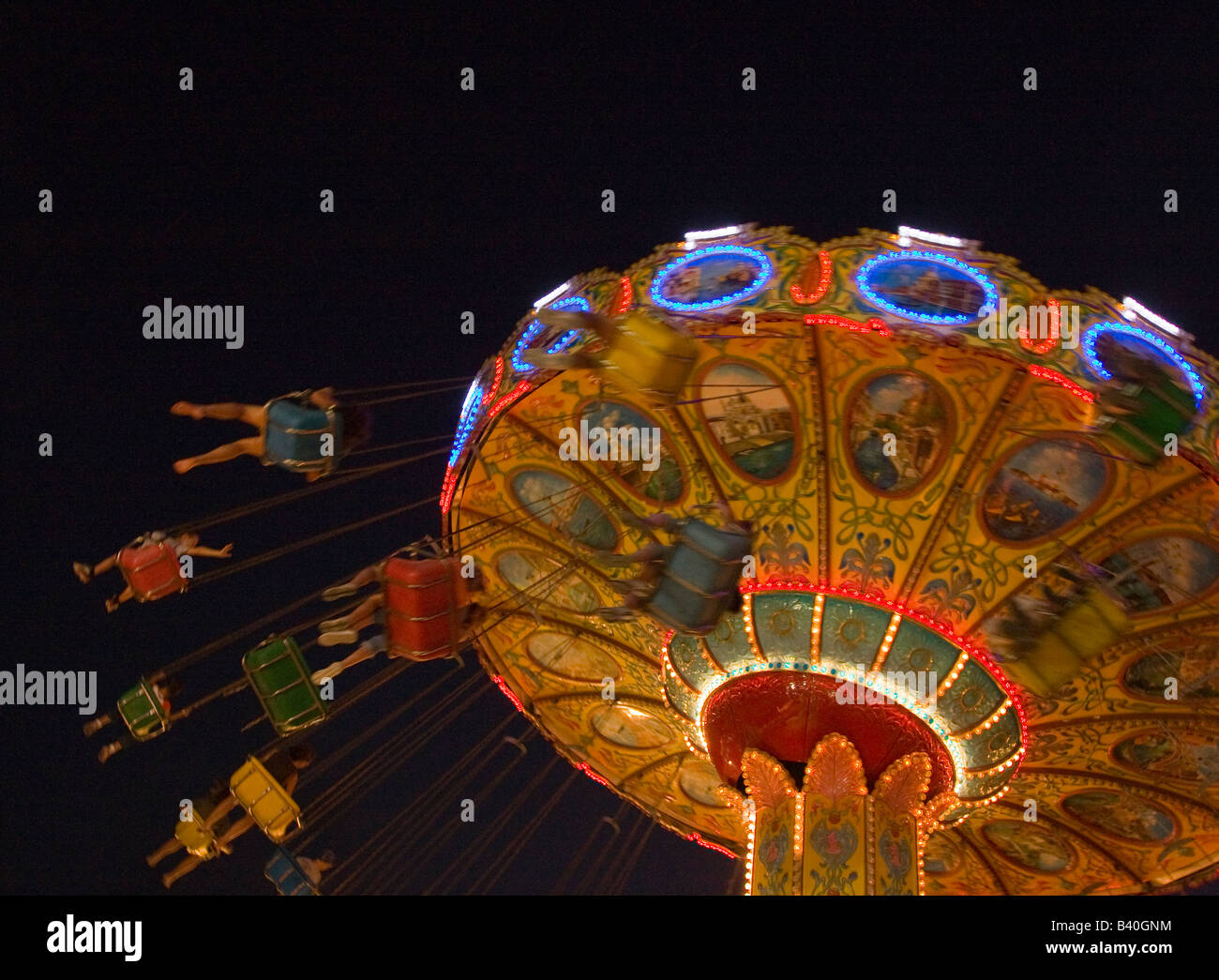 Someone On Ride People on an amusement park ride Stock Photo - Alamy