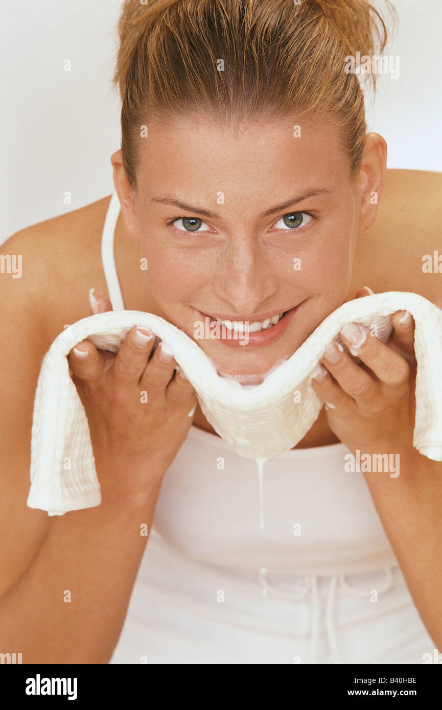 Young woman cleaning face Stock Photo - Alamy
