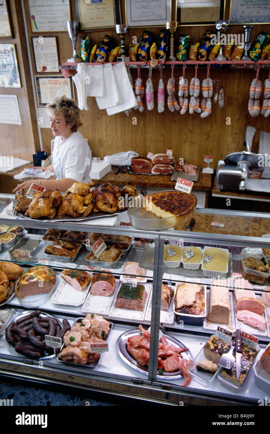 Meats and goods on display in a butcher shop, Eu, Normandy Region, France Stock Photo