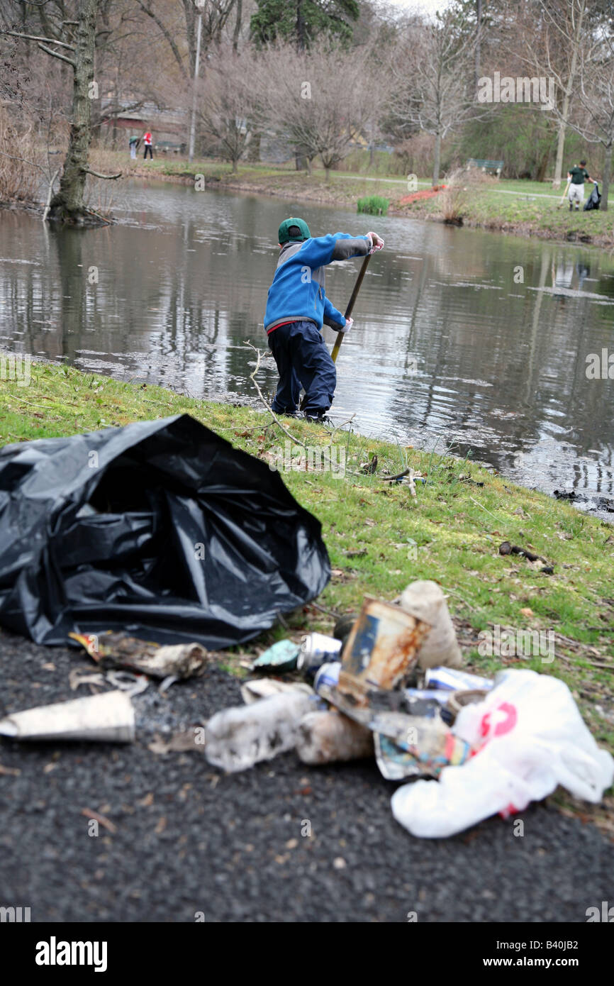 Trash bag with litter gathered from spring park clean-up Stock Photo