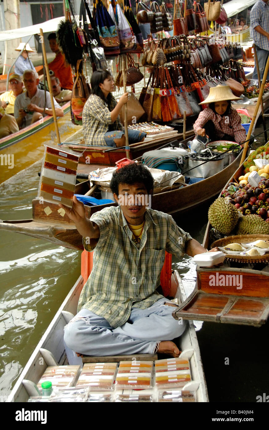 Floating Market Bangkok Thailand Asia Damnoen Saduak Floating Market Vendor selling Spices travel holiday vacation travel boats Stock Photo