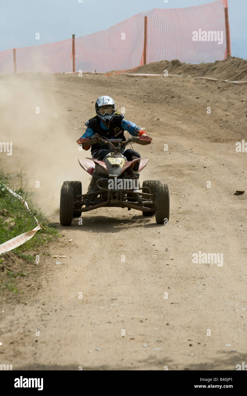 Quad rider during off road race Stock Photo Alamy
