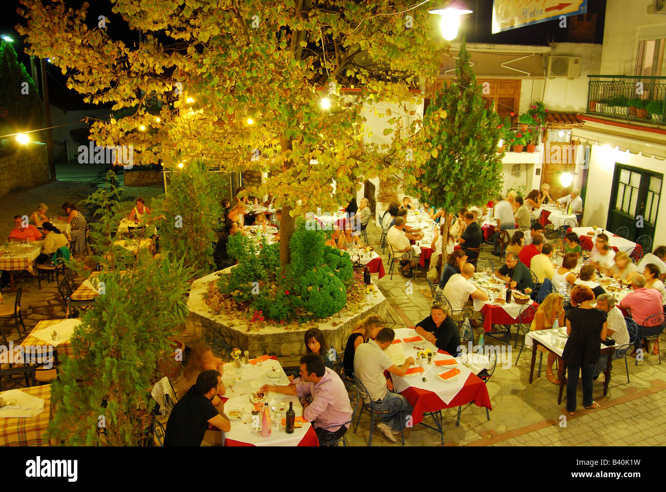 Outdoor Greek restaurant at night, Kryopigi, Kassandra Peninsula, Chalkidiki, Central Macedonia, Greece Stock Photo