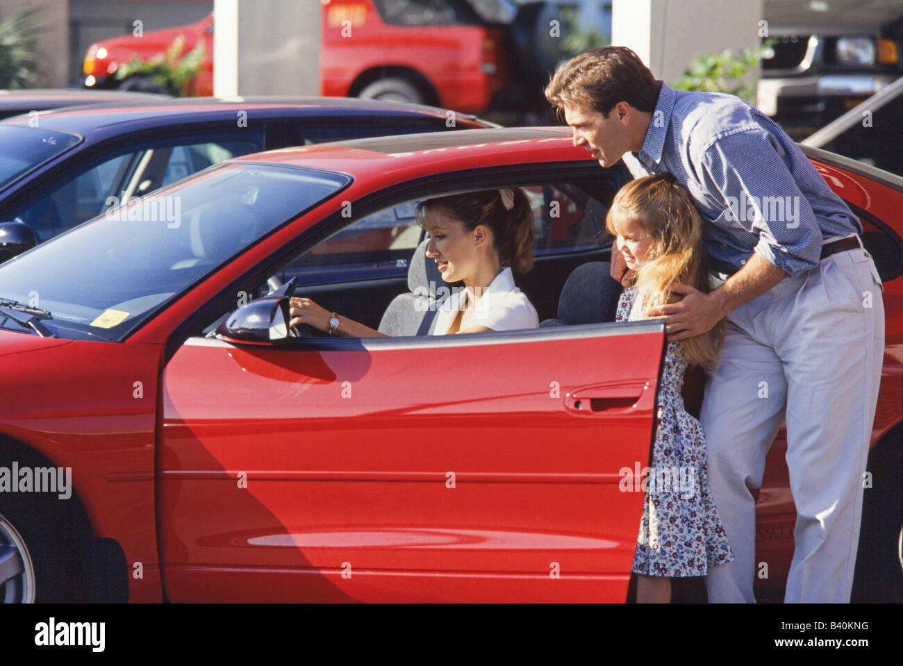 Family shopping for car, Miami Stock Photo Alamy