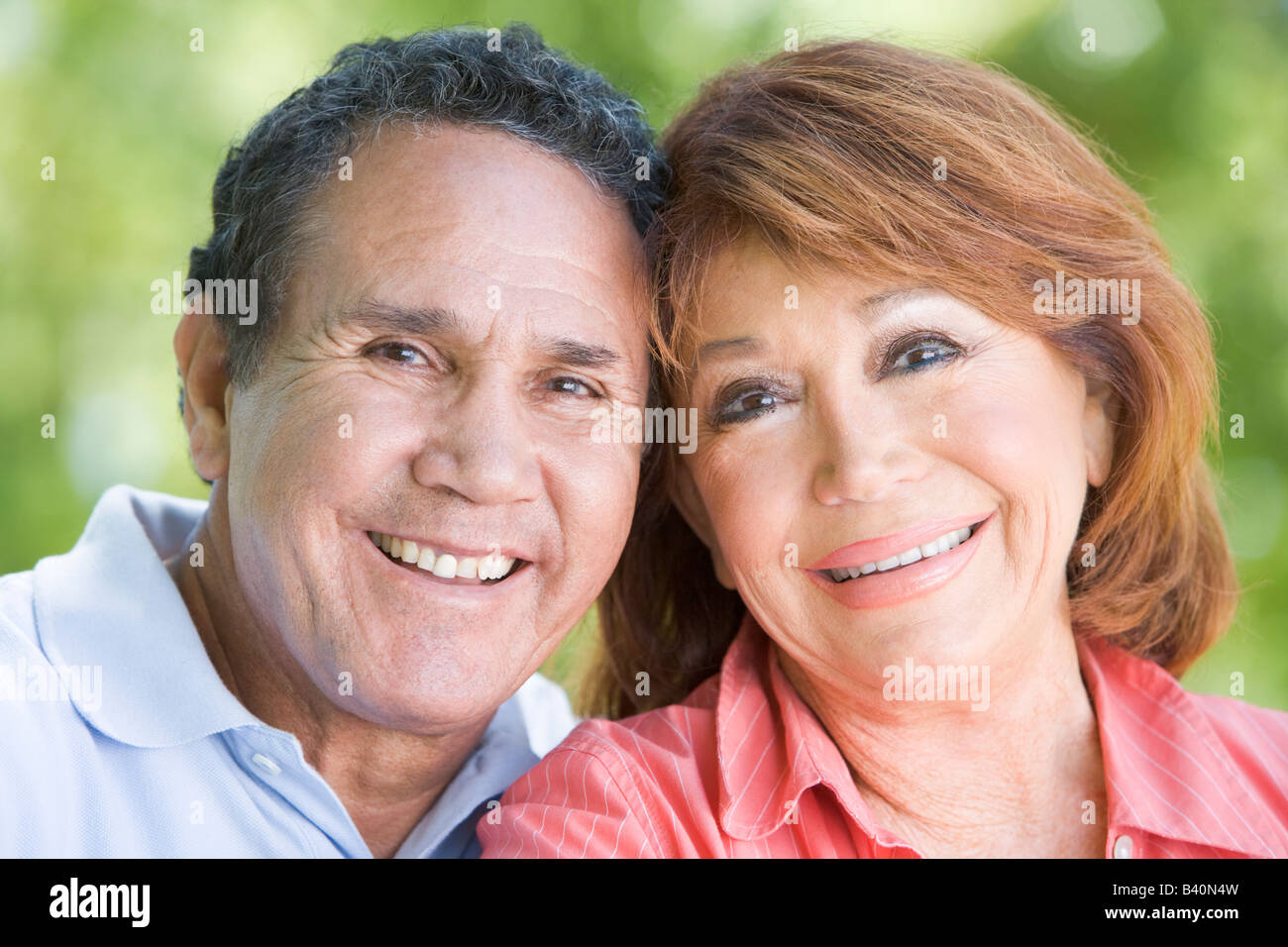 Couple outdoors smiling Stock Photo - Alamy