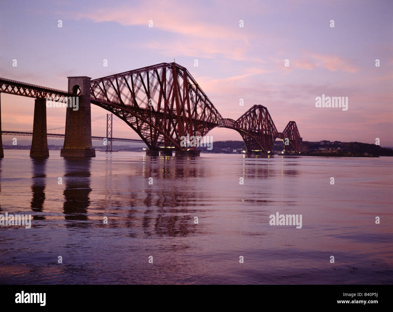 dh Railway Bridge Scotland FORTH BRIDGE FIRTH OF FORTH Scottish engineering Victorian Cantilever steel rail bridges Lothian sunset dusk Stock Photo