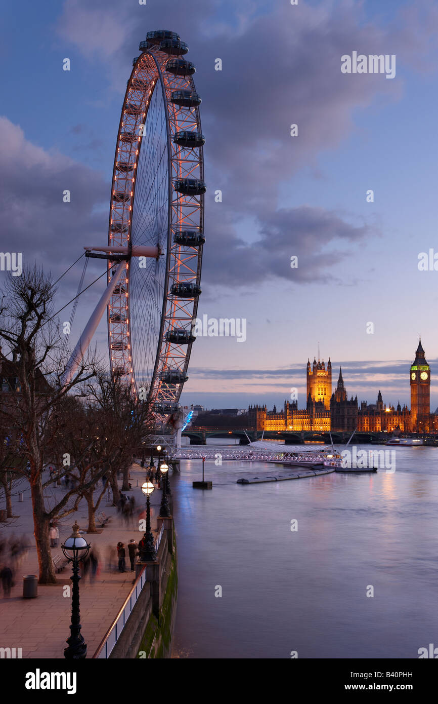 the Embankment (South Bank) with the London Eye, River Thames and the Palace of Westminster at dusk, London, England, UK Stock Photo