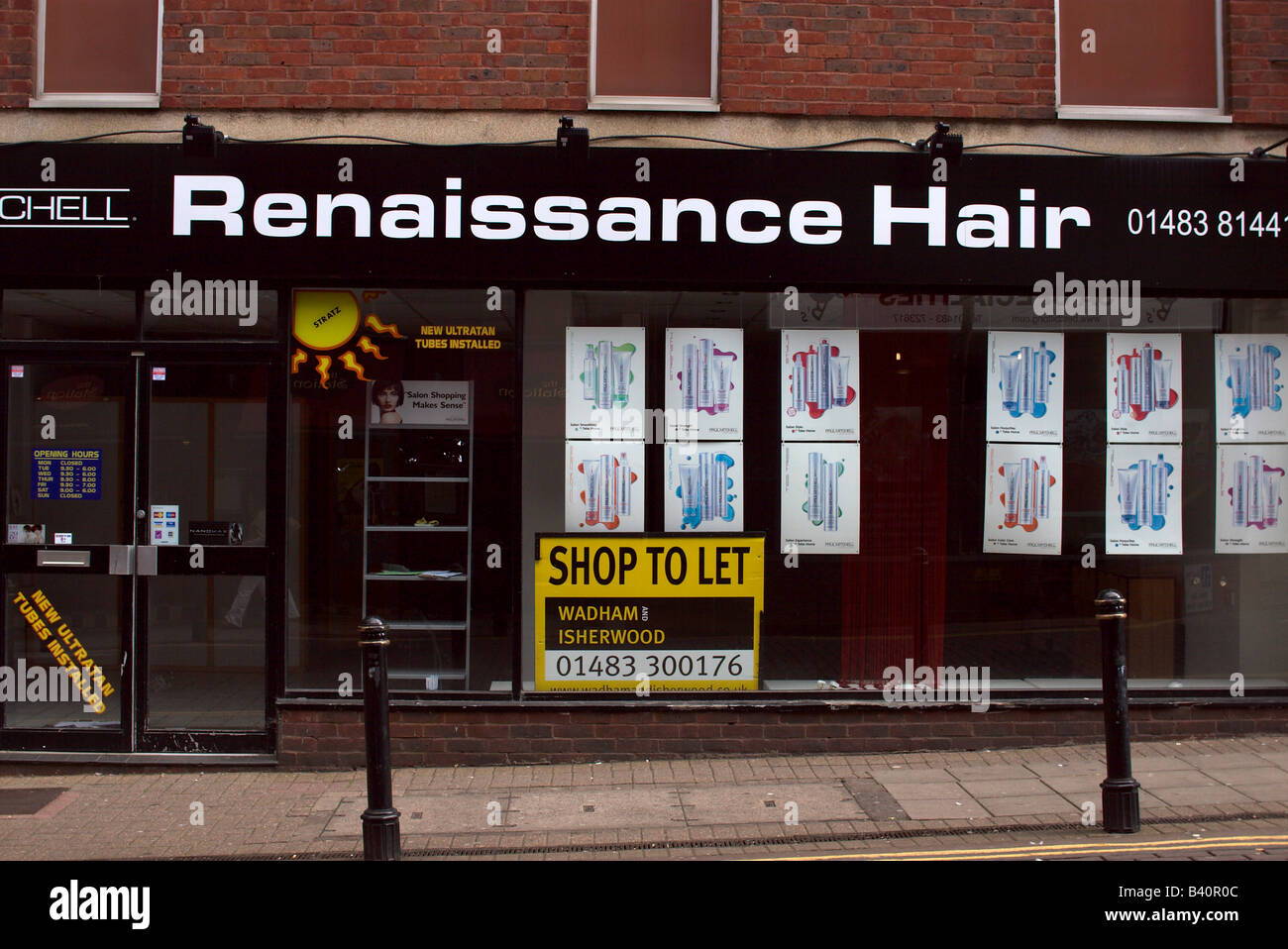 UK England Surrey Woking Renaissance Hair out of business shop to let Stock Photo