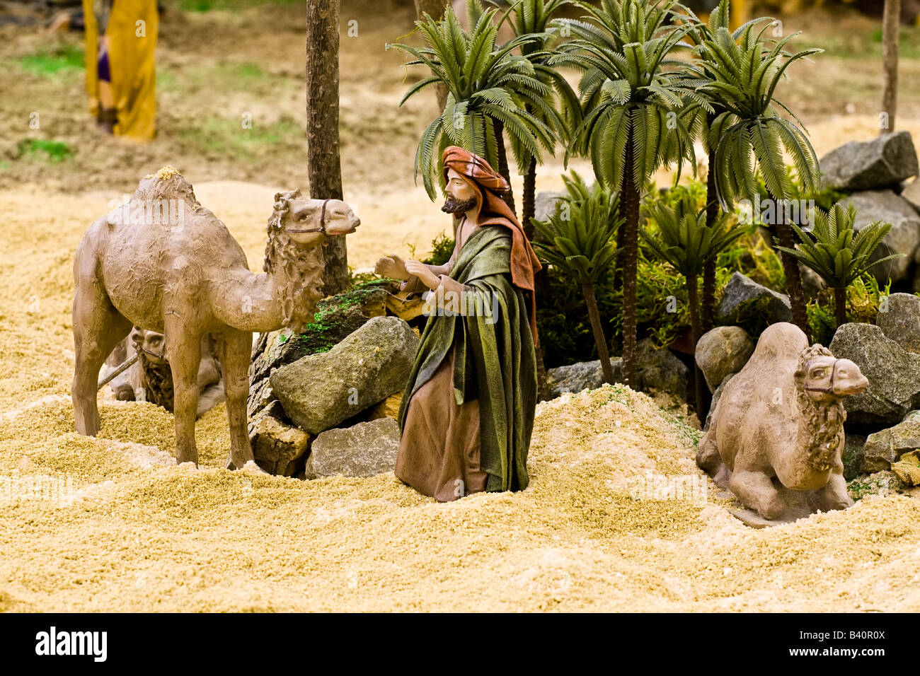 Arabic man with camels figurines in a crib scene Stock Photo - Alamy