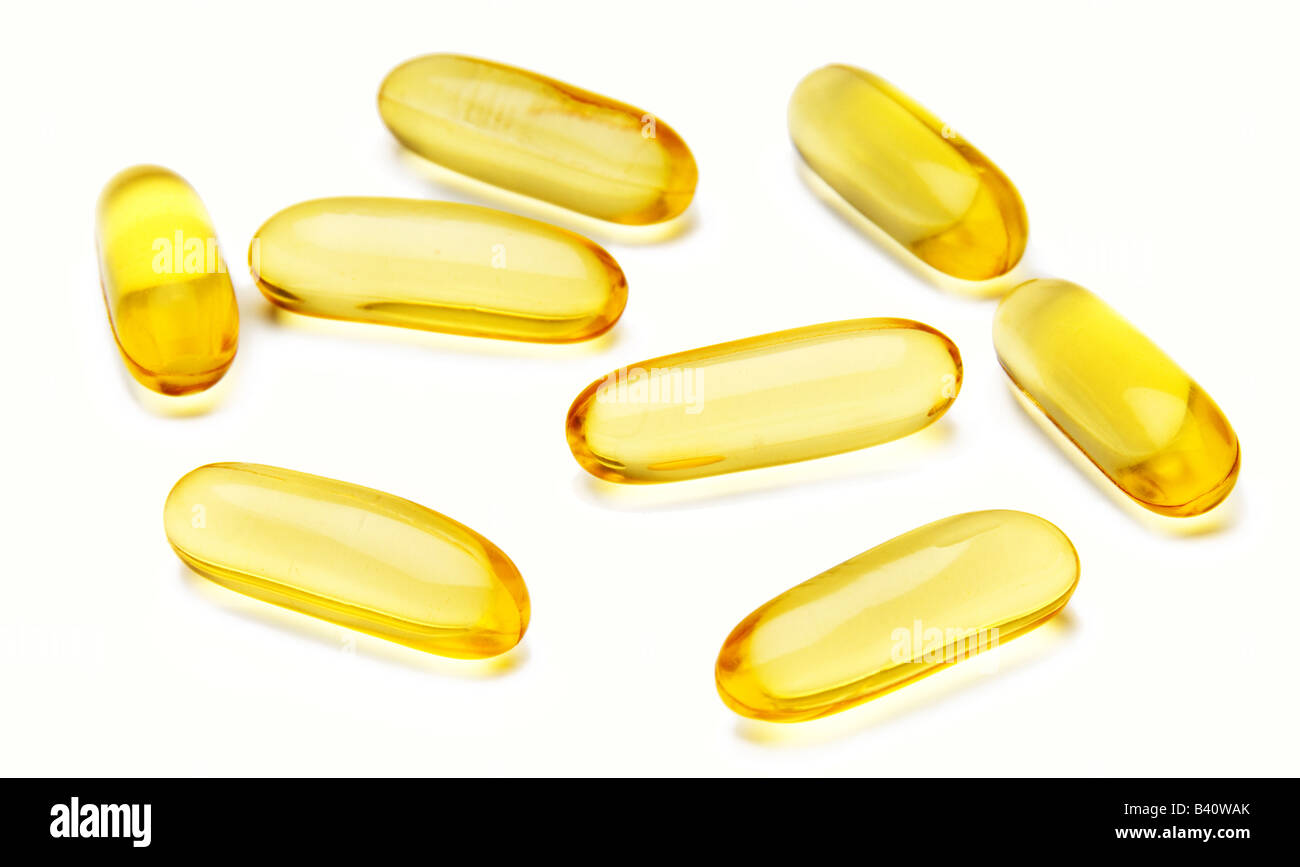 Vitamin E capsules on white background. Stock Photo