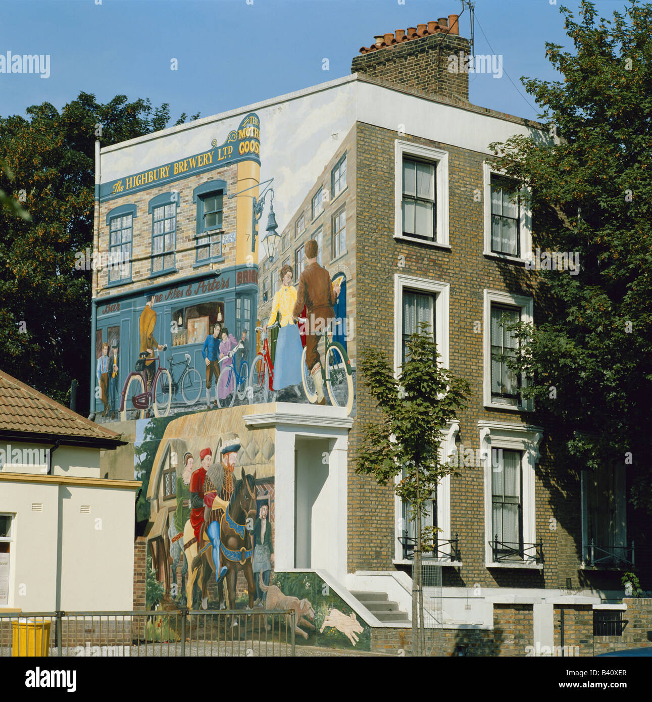 A street scene painted on an end wall of a house in Islington, London, UK Stock Photo