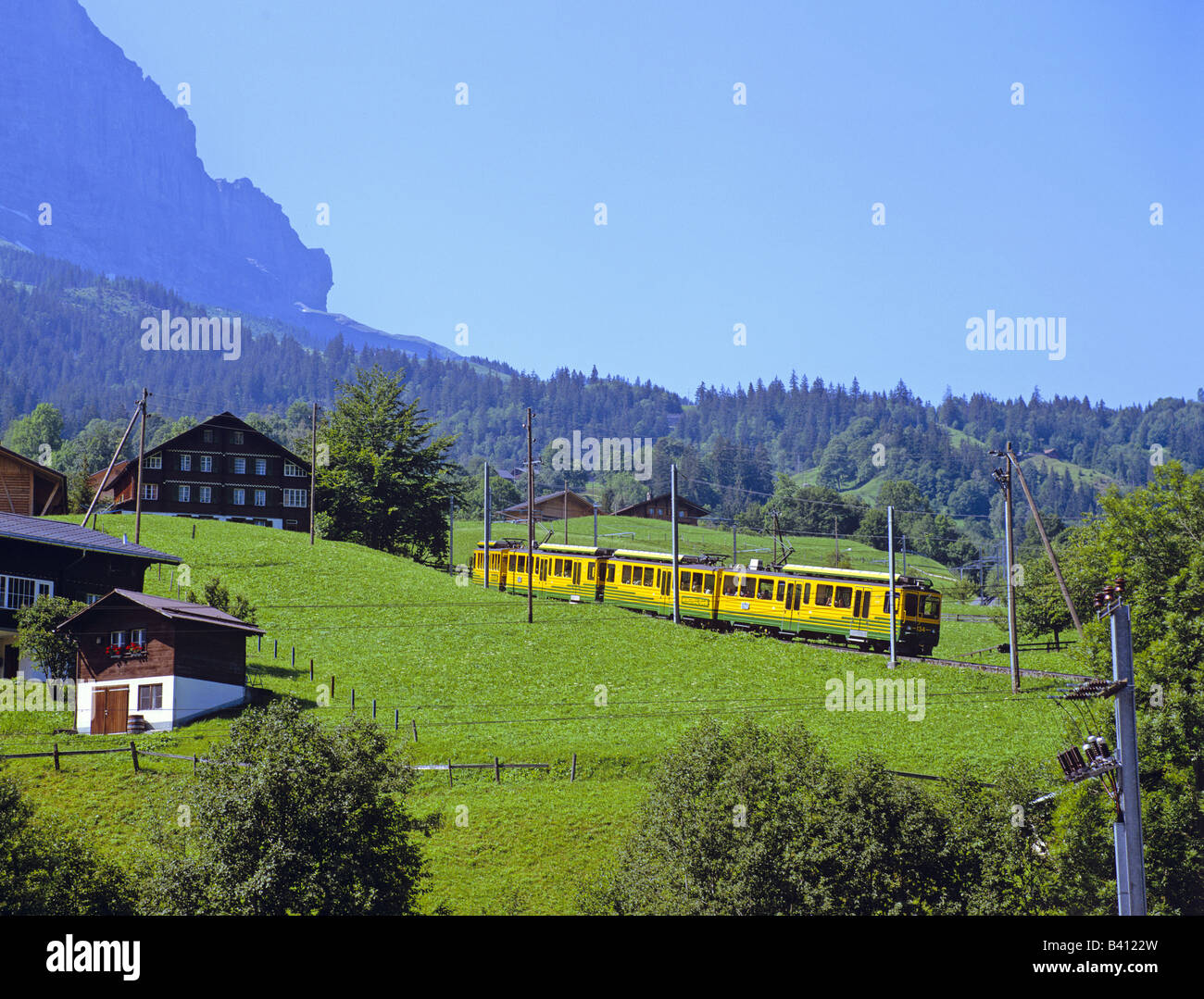 Mountain railway runs Grindelwald Switzerland Stock Photo - Alamy