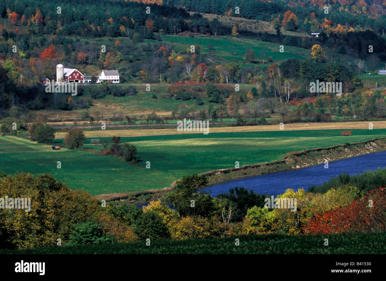 North America, United States, Vermont. Red barn on rolling hills. Stock Photo
