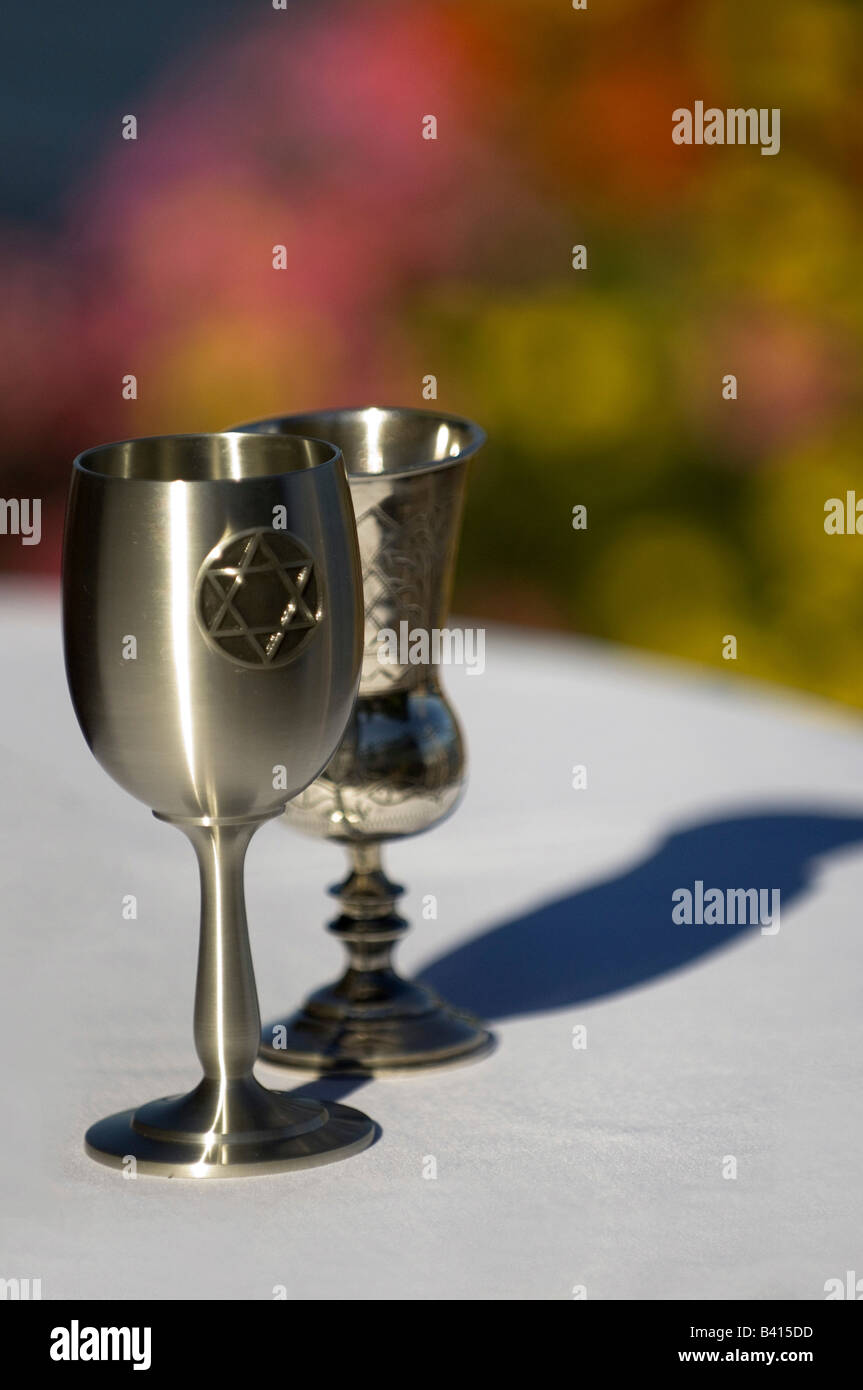 USA, Seattle, Washington, Silver Kiddush Wine Cups standing on a white