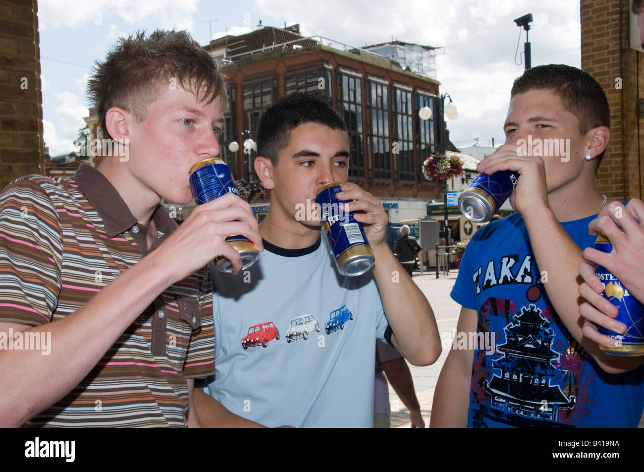 Teenage boys in Street mobile phones fighting drinking smoking Model  Released Shoot No 3643 Stock Photo - Alamy