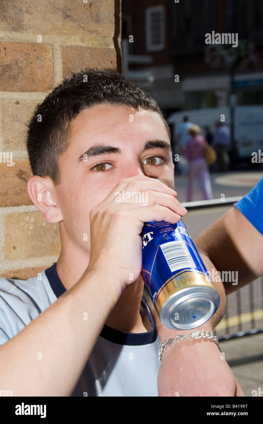 Teenage boys in Street mobile phones fighting drinking smoking Model  Released Shoot No 3643 Stock Photo - Alamy