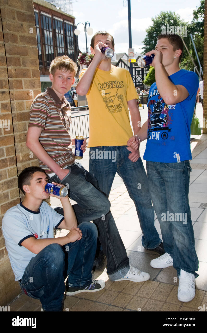 Teenage boys in Street mobile phones fighting drinking smoking Model  Released Shoot No 3643 Stock Photo - Alamy