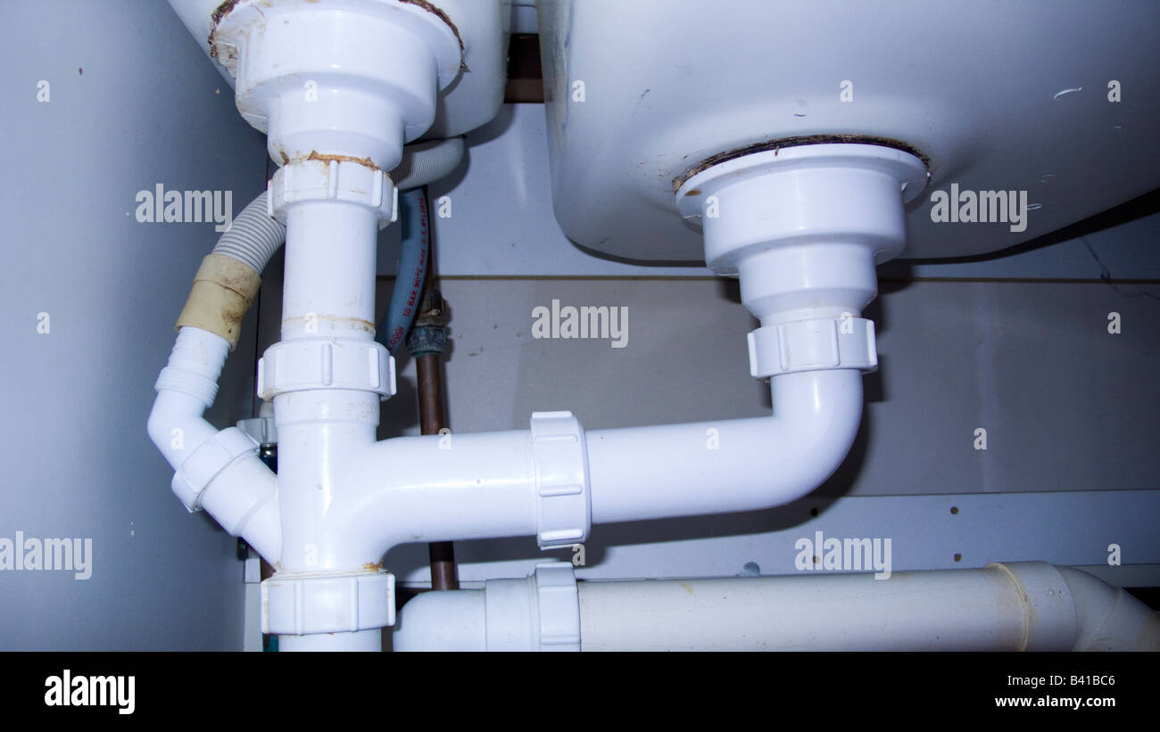 Plumbing under sink Stock Photo Alamy