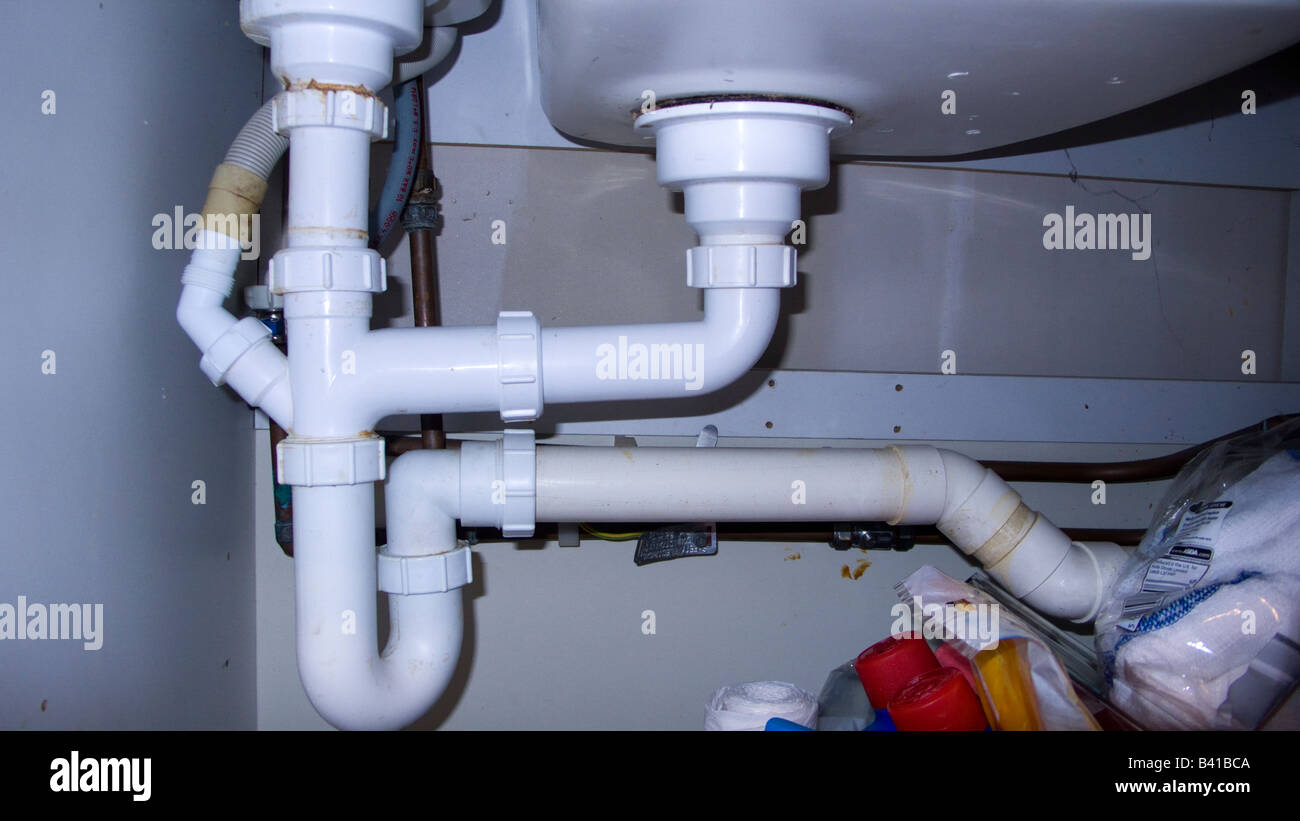 Plumbing under sink Stock Photo Alamy