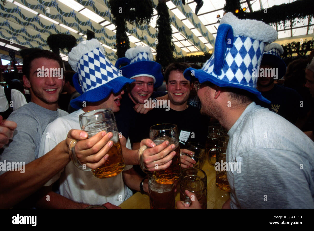 geography / travel, Germany, Bavaria, Munich, Oktoberfest, beer tent, Hacker Pschorr, group of men, beer mugs, celebrate, hat, t Stock Photo