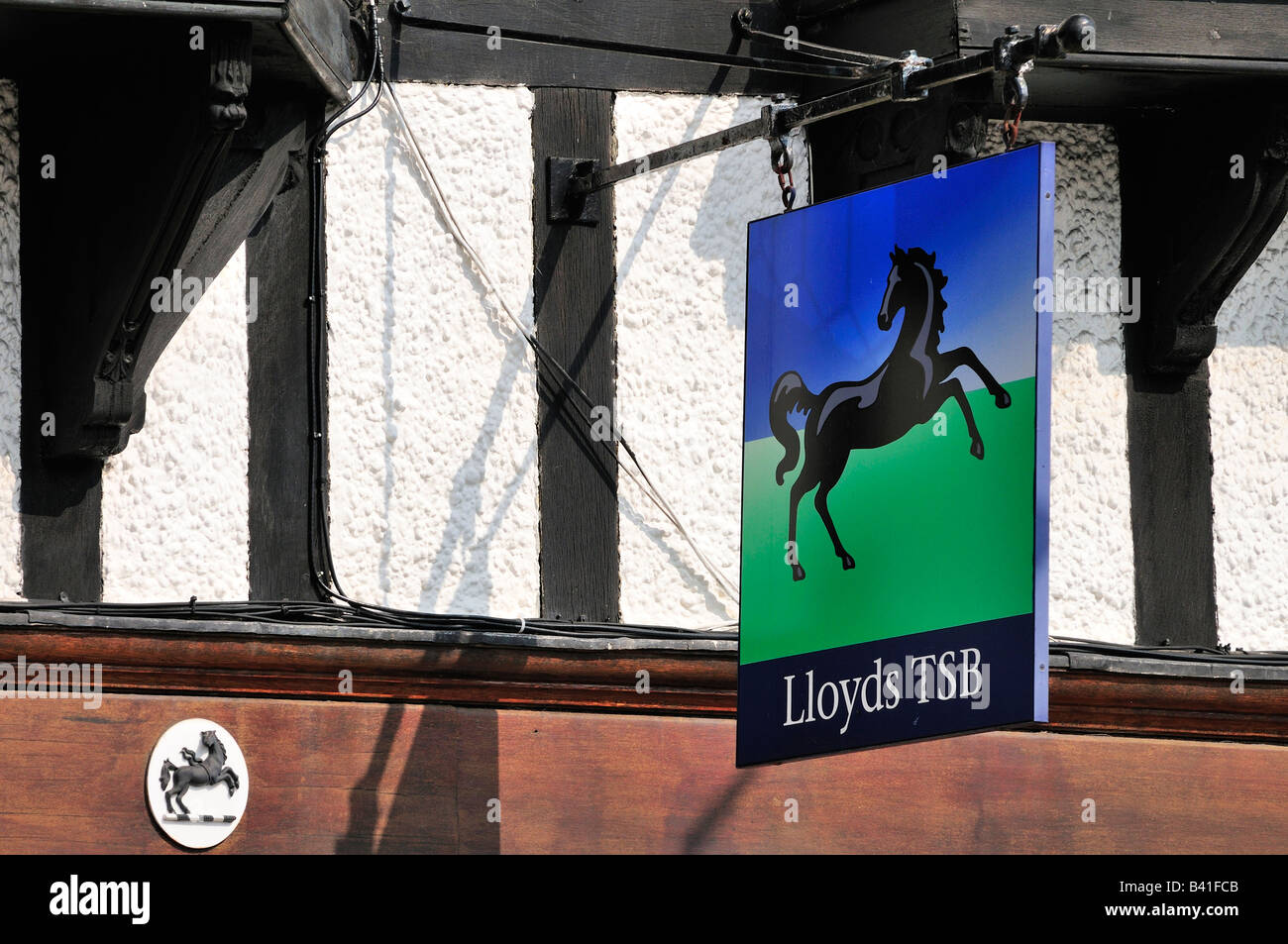 Swinging Lloyds TSB bank sign ancient timbered framed building Stock Photo