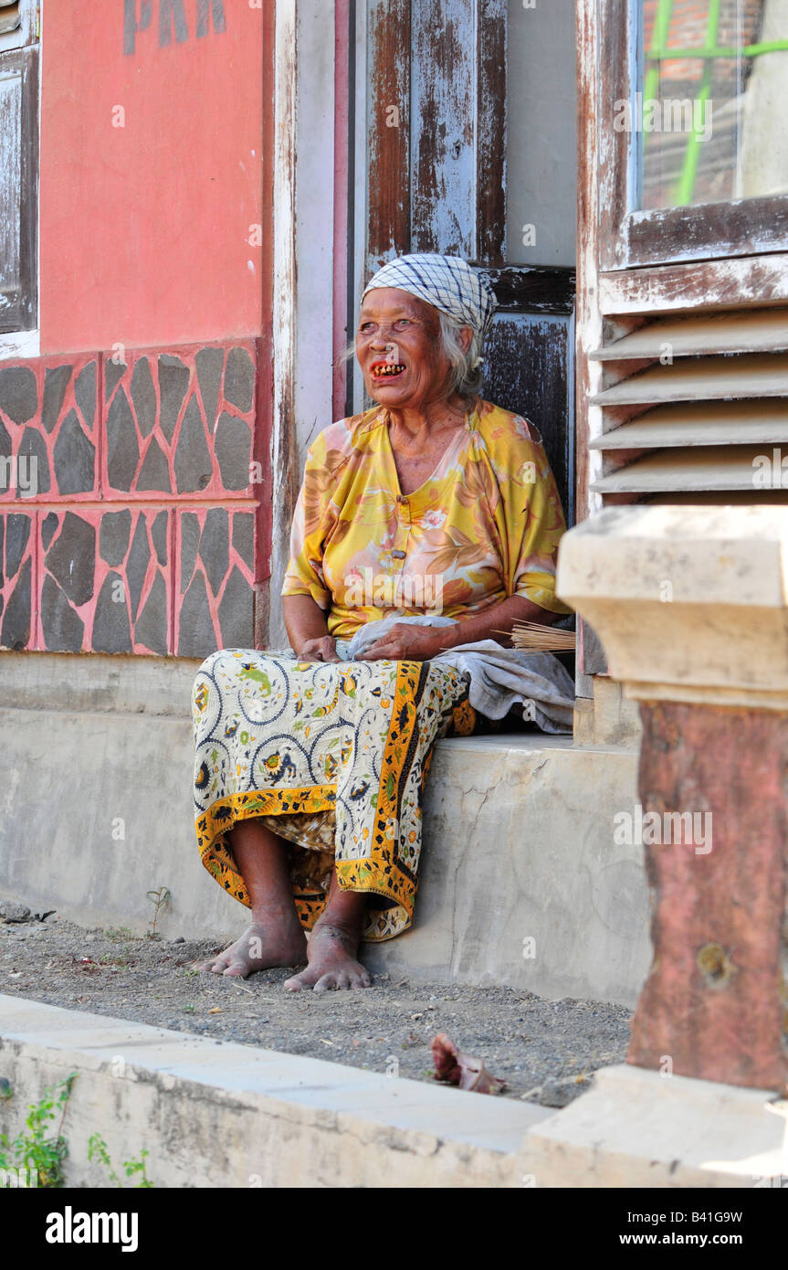 bali aga village life, old lady sitting in her doorway, bali aga village life, semberan , north bali , indonesia Stock Photo