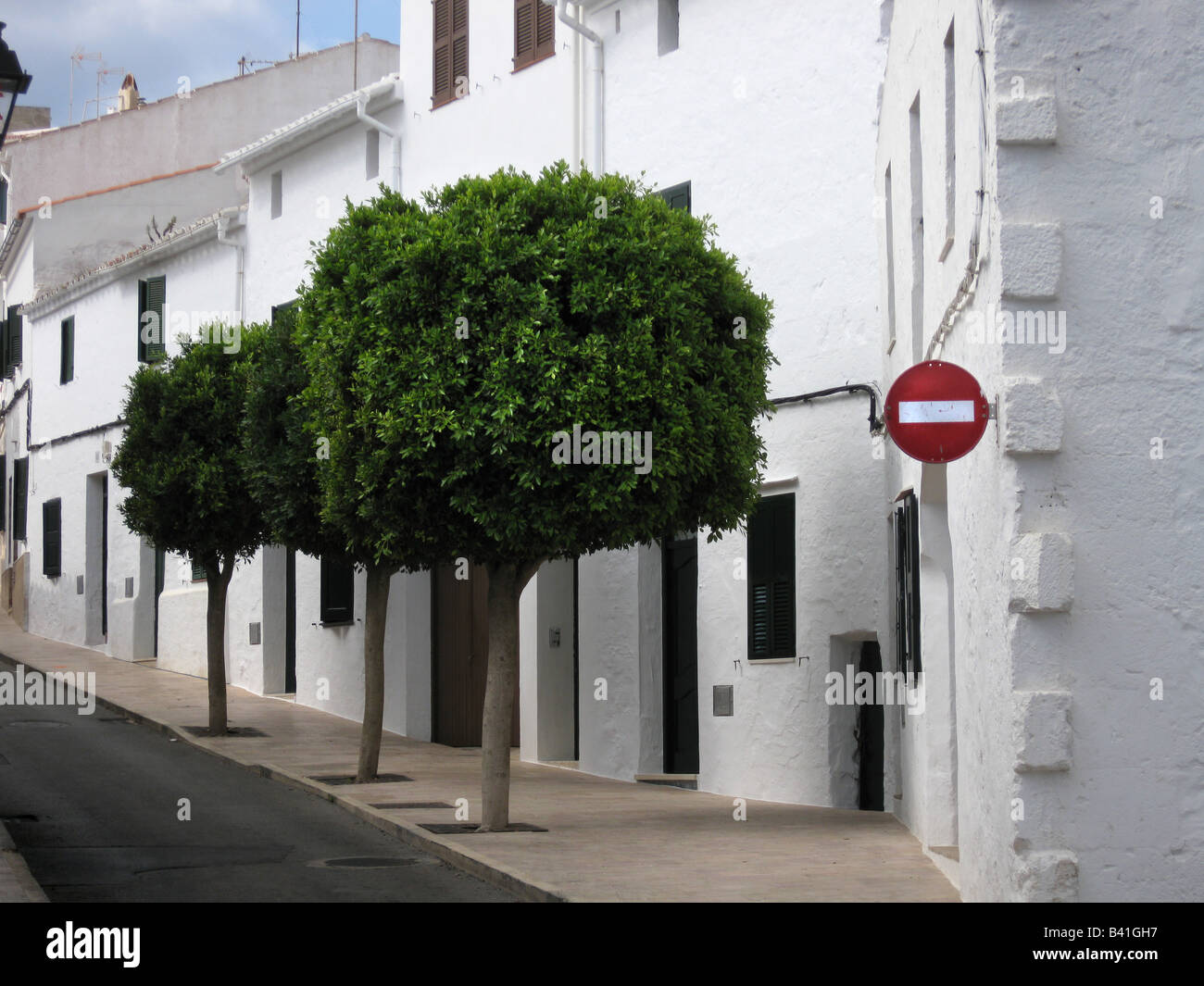 Round trees and No Entry Sign, Menorca Stock Photo