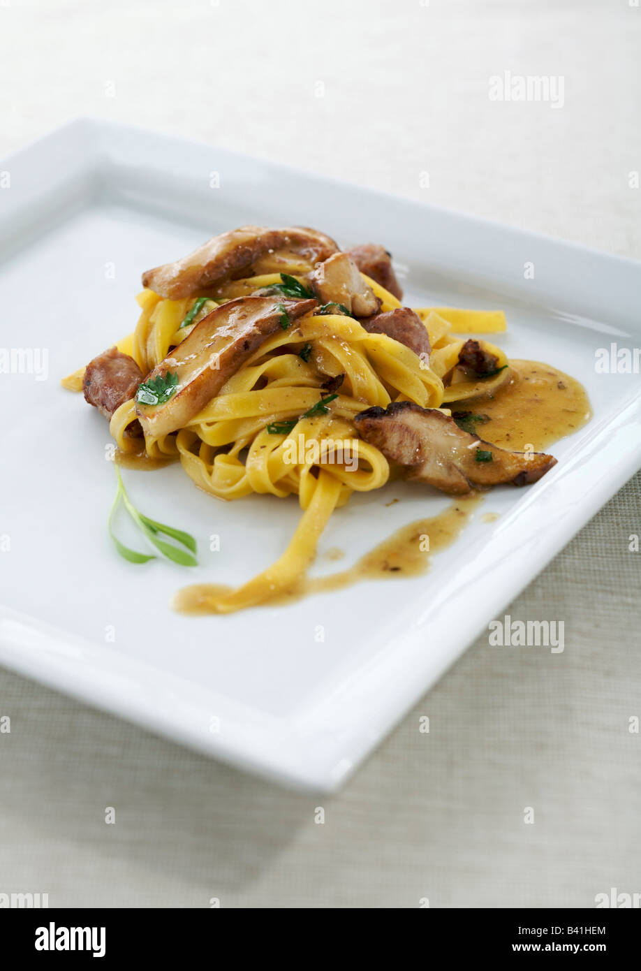 Italian tagliatelle pasta with sausage and mushrooms Stock Photo Alamy