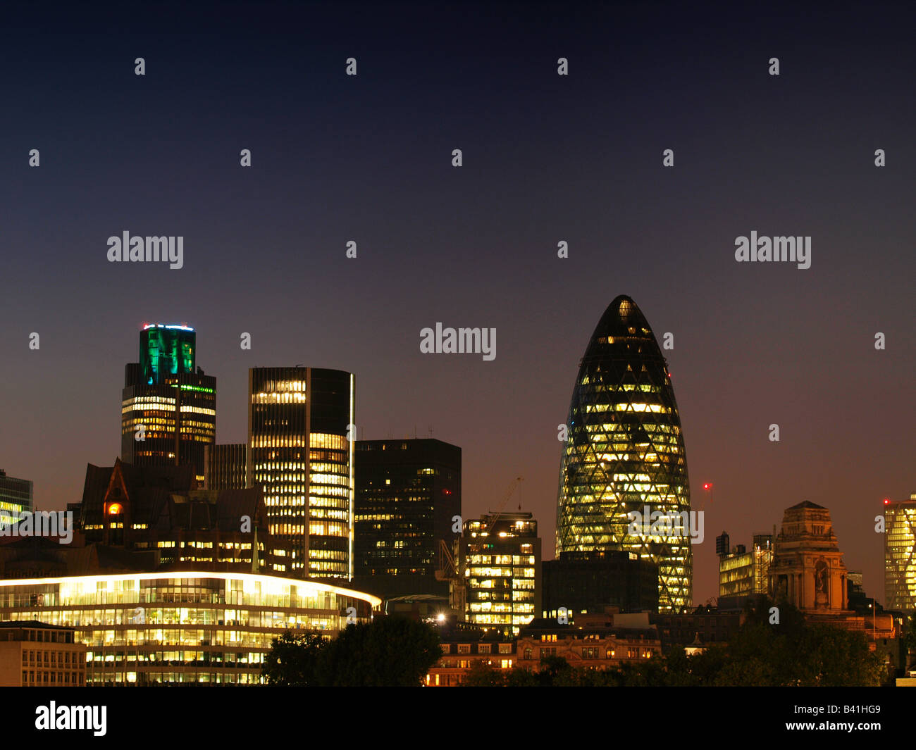 Skyline of the London city with the Gherkin building by night United Kingdom Stock Photo
