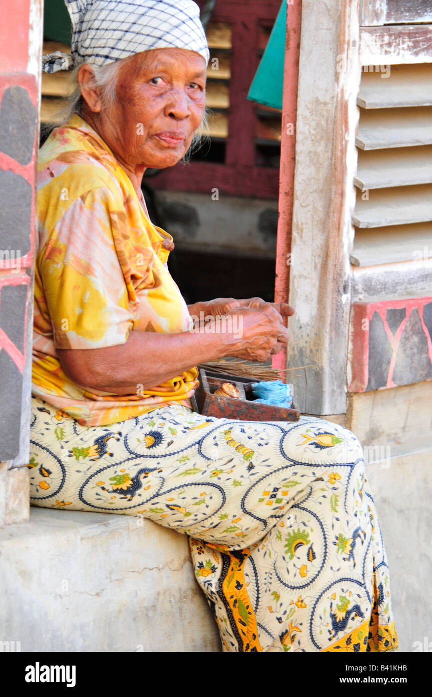 bali aga village life, old lady preparing food , bali aga village life, semberan , north bali , indonesia Stock Photo