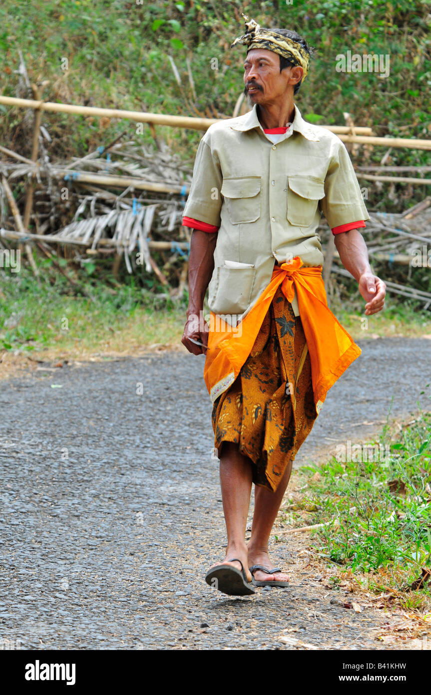 village temple festival, man going to pura puseh, desa pakraman bebetin, sawan , buleleng regency, north west bali, indonesia Stock Photo