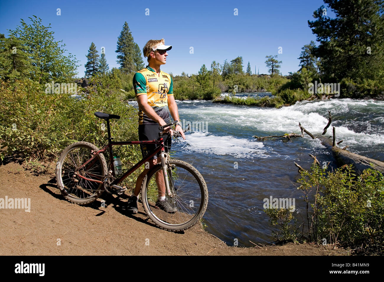 USA OREGON BEND A mountain biker on the Deschutes River Trail near Benham Falls between Bend and
