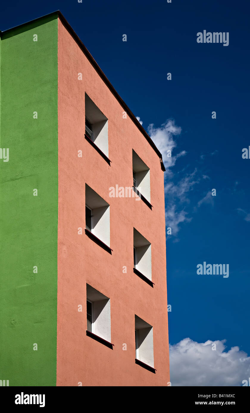 Windows in brightly painted concrete blocks of flats Miastko Poland Stock Photo