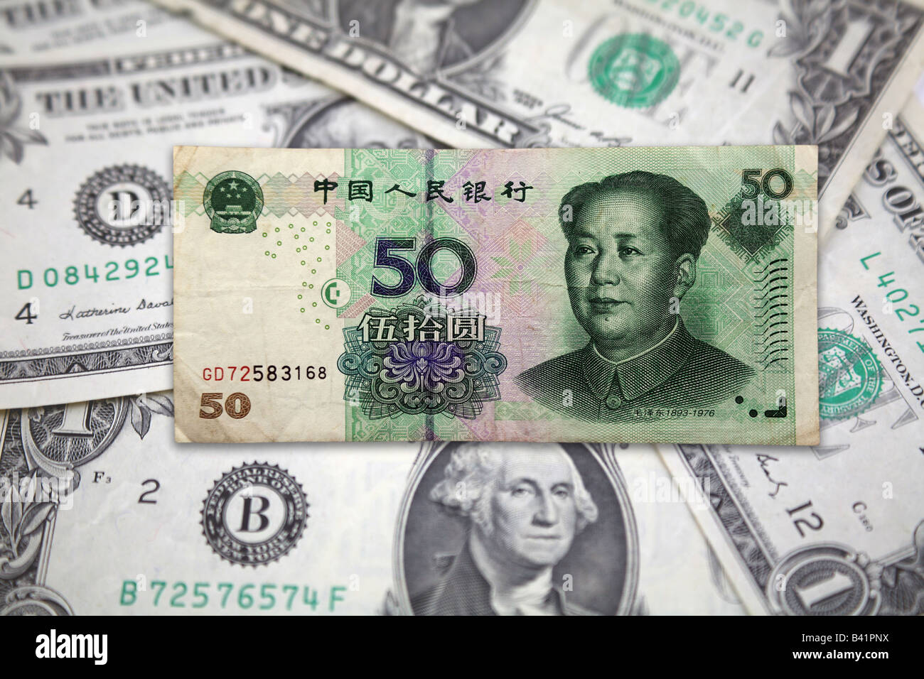 Zhongguo Bank notes from China Renmin Yingyang and Green Back Bank note Dollars from United States of America to represent Trade Stock Photo