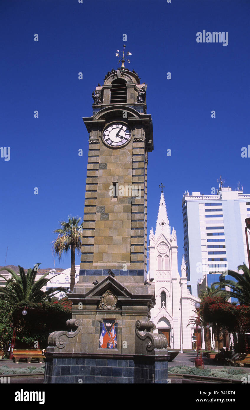 Clock tower in Plaza Colon, cathedral behind, Antofagasta, Chile Stock Photo