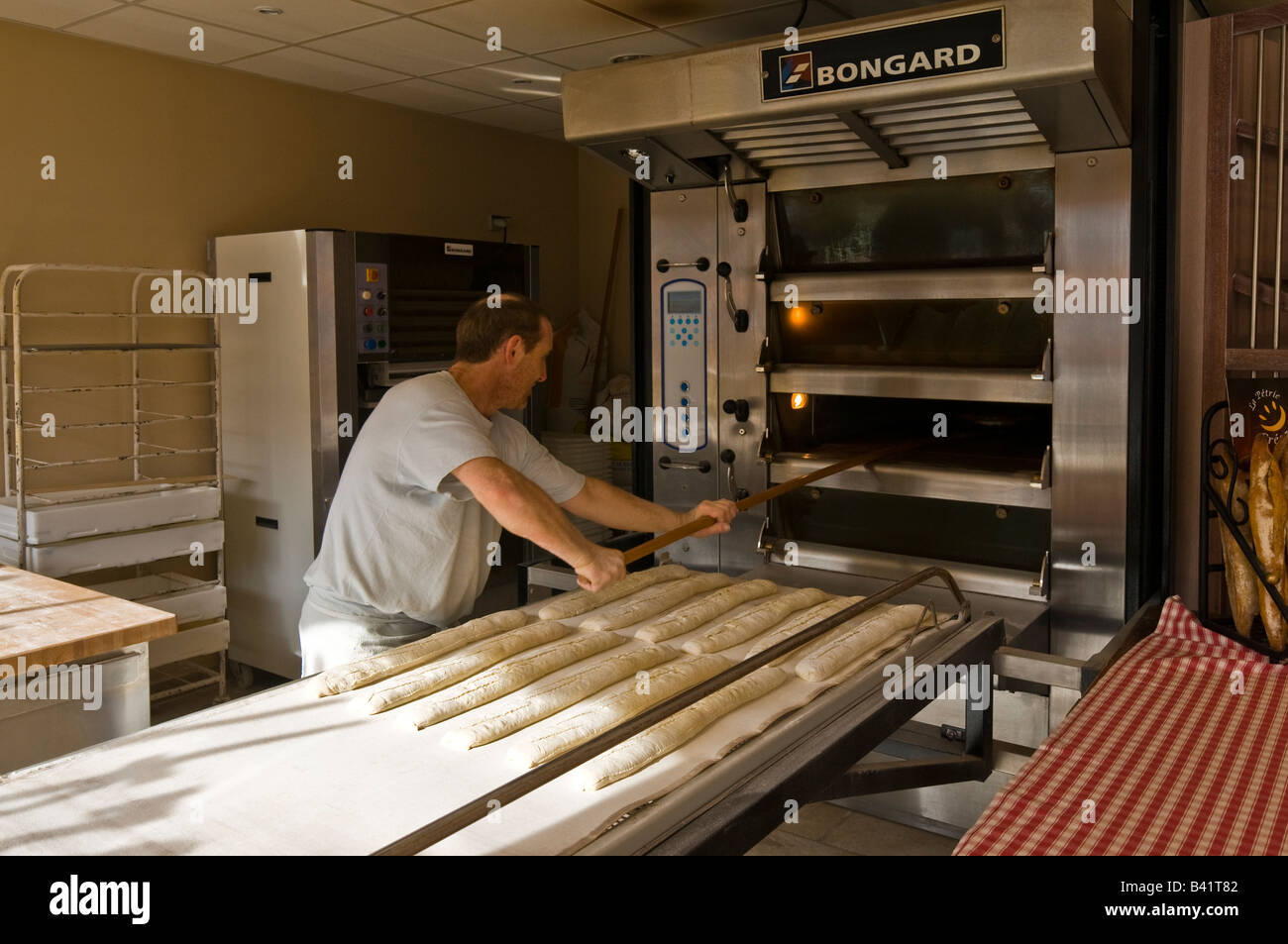 Baker making French bread, France. Stock Photo
