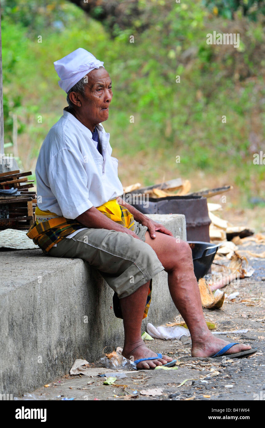 bali aga village life, old man waiting for bus to singaraja, semberan, bali aga village , north bali Stock Photo