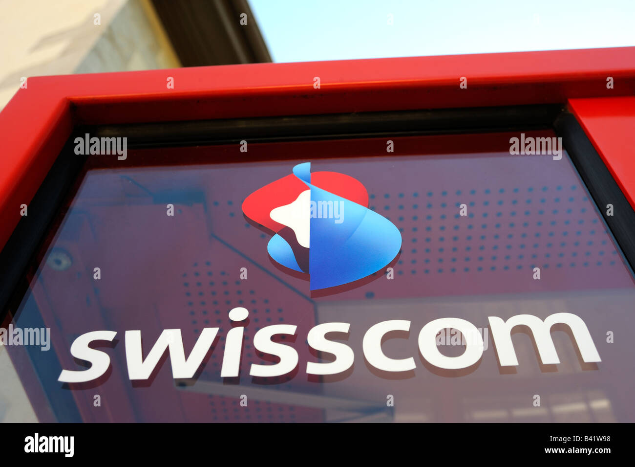 Telephone booth with swisscom logo on it. Stock Photo