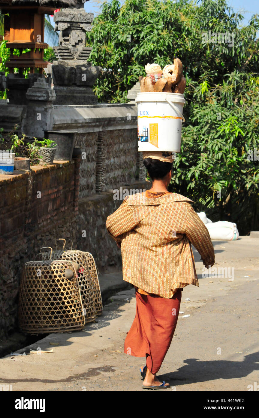 bali aga village life, lady with offerings going to temple, bali aga village life, semberan , north bali , indonesia Stock Photo