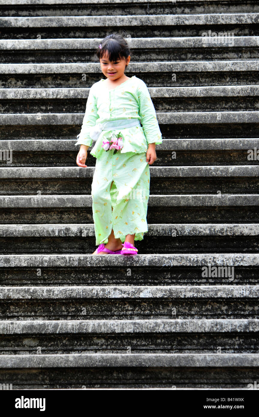 village temple festival, little girl leaving temple ,desa pakraman bebetin,sawan , buleleng regency , north west bali,indonesia Stock Photo